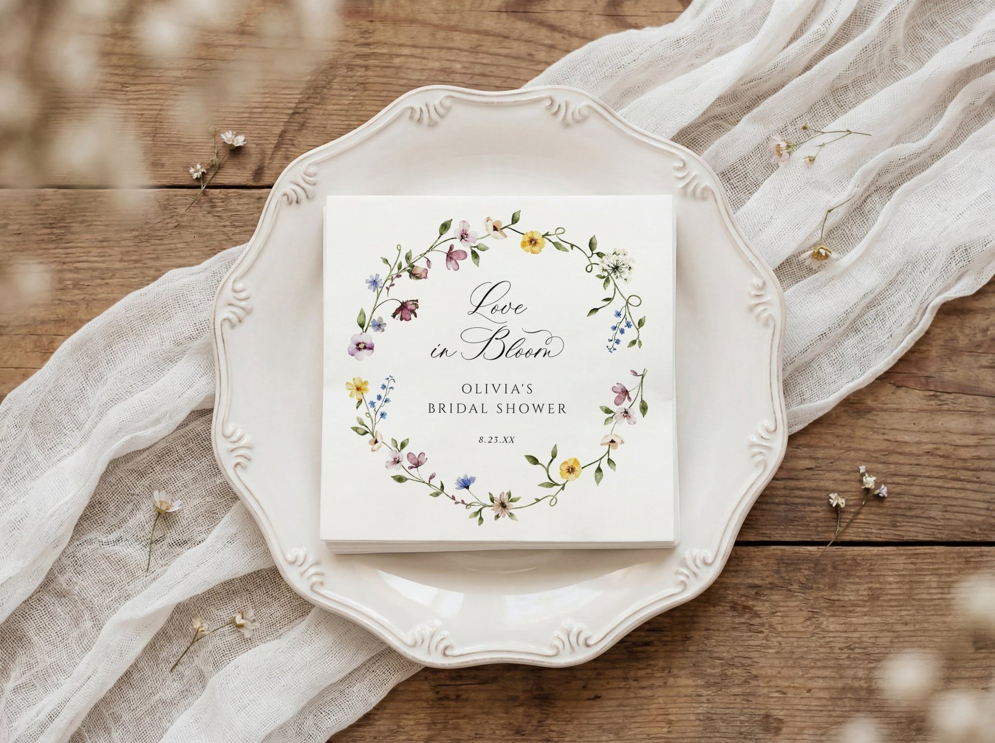 Bridal shower napkins with watercolor wildflower wreath and elegant love is in bloom design