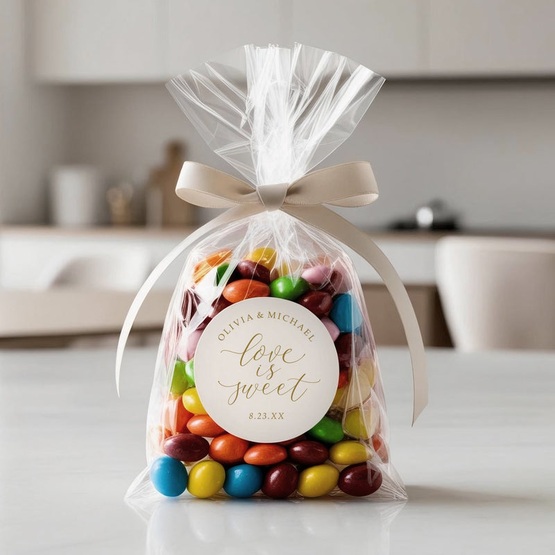 Love is sweet wedding favor sticker on clear bag filled with colorful candy