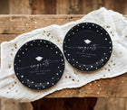 Black and white graduation plates with handwriting script, stars and graduation cap