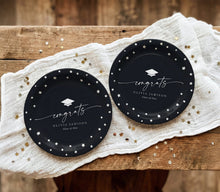 Black and white graduation plates with handwriting script, stars and graduation cap