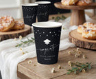Graduation paper cups with modern handwriting script, stars and graduation cap