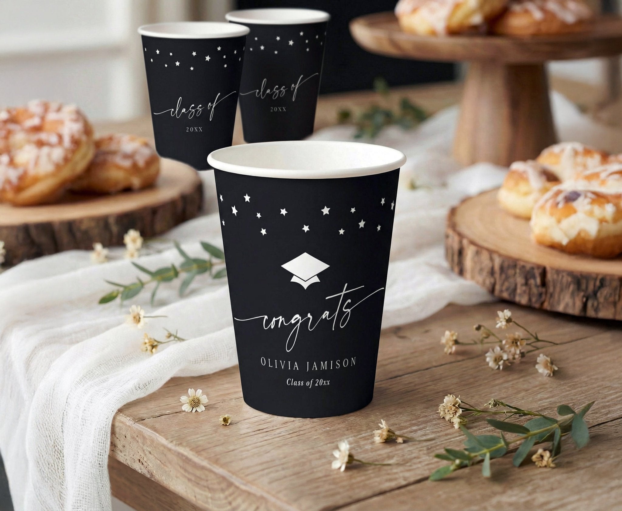 Graduation paper cups with modern handwriting script, stars and graduation cap