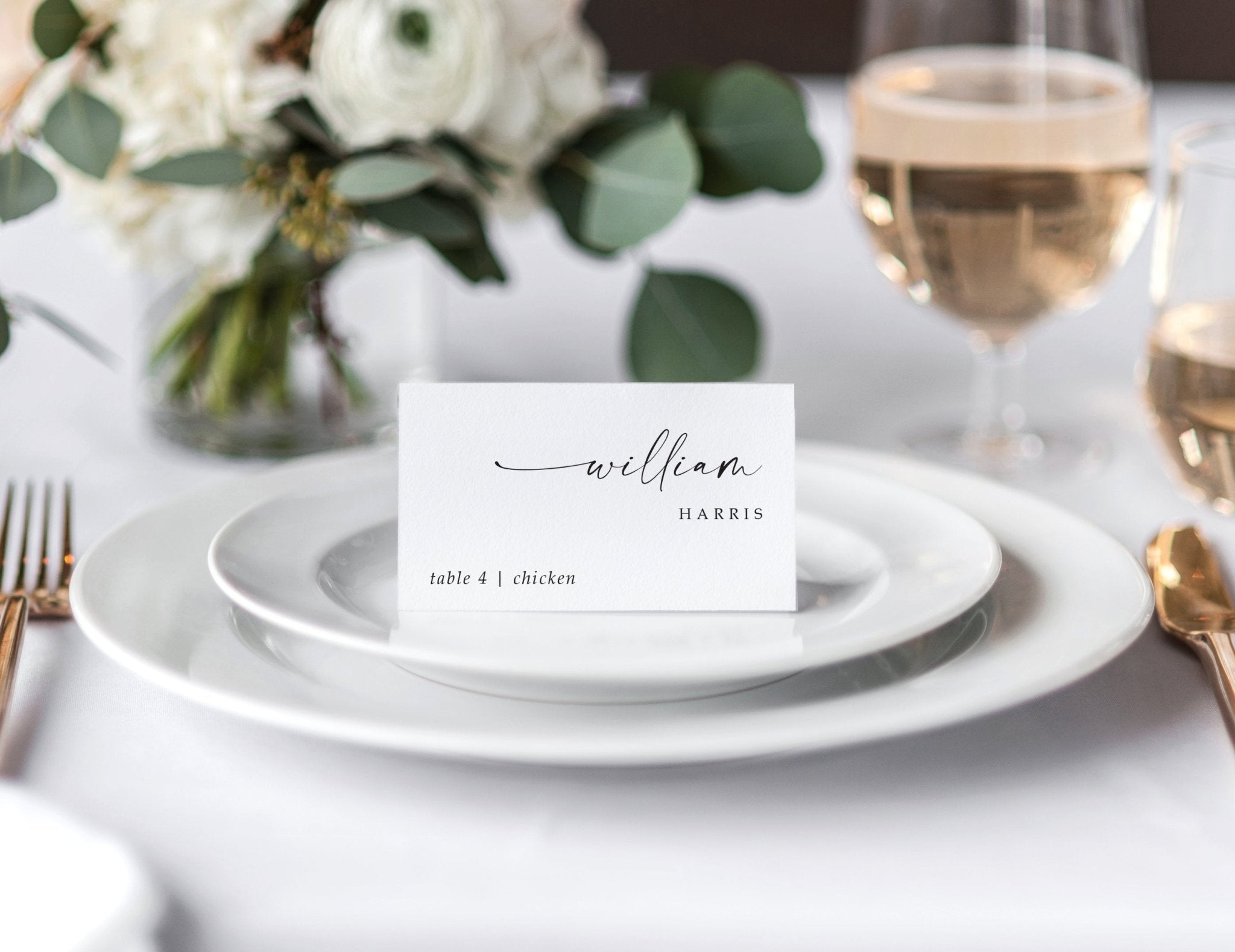 Modern custom wedding place card with guest name and meal choice on white tent cards.