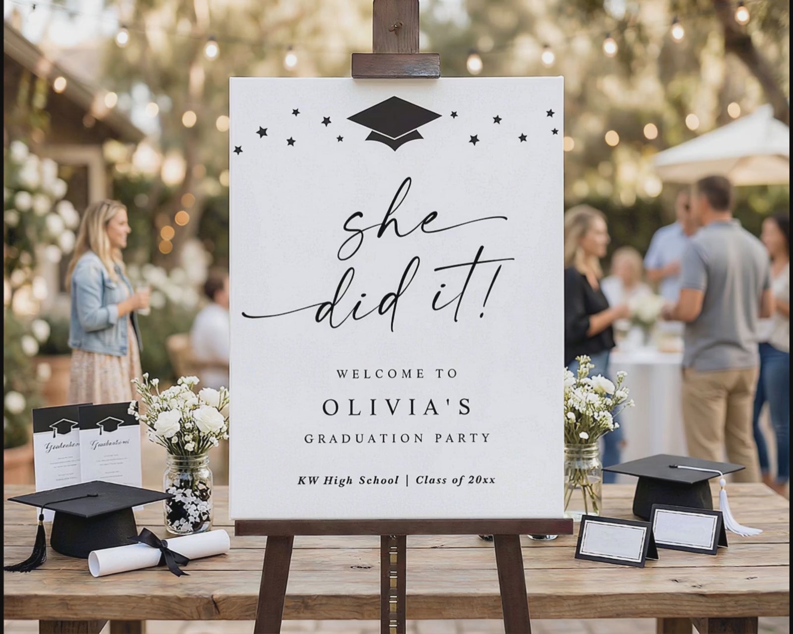 Black and white she did it graduation welcome sign with stars and graduation cap
