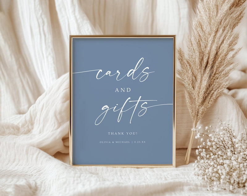 Dusty Blue sign with 'cards and gifts' text on a soft fabric background