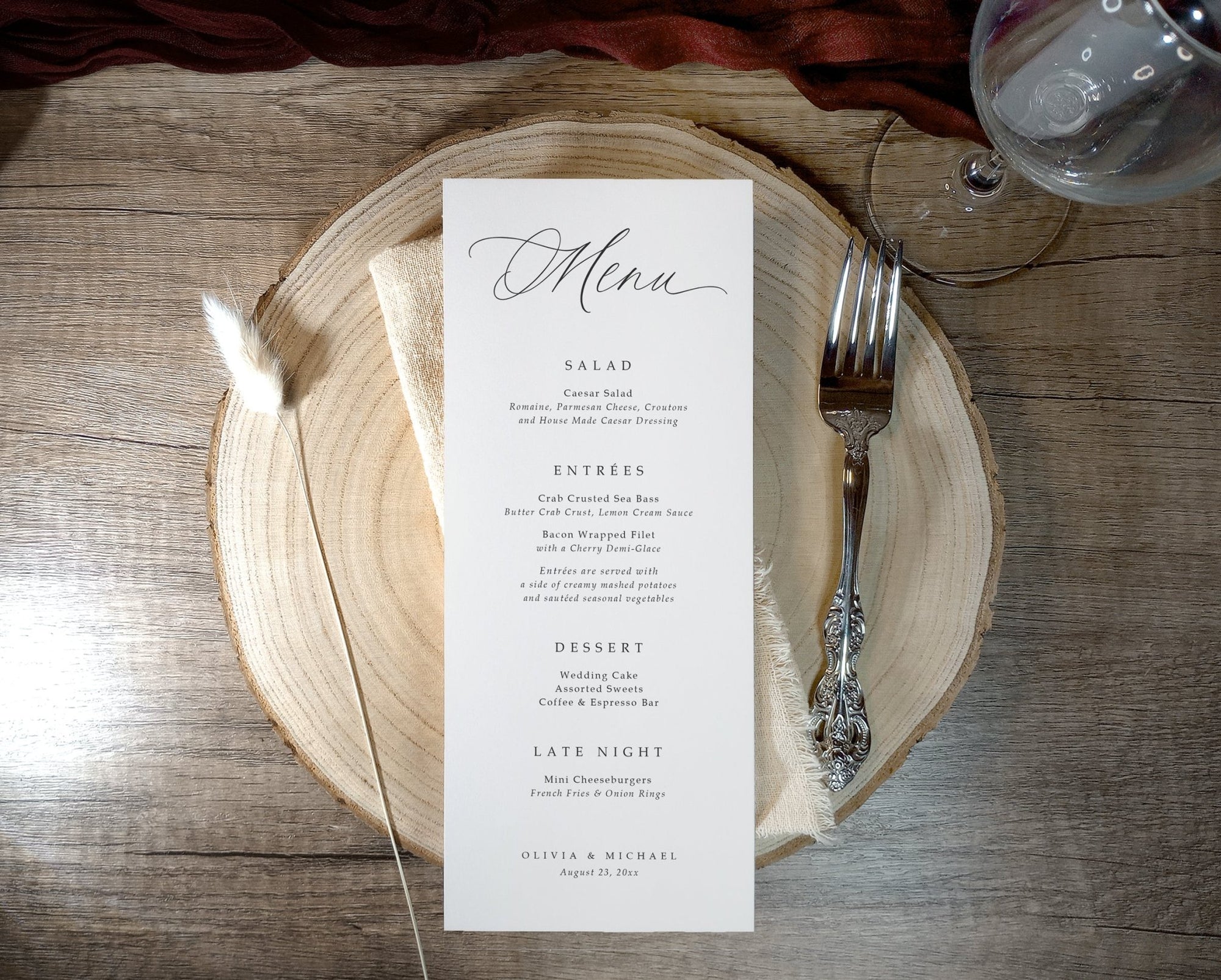 Wedding menu on a wooden plate with a fork on a rustic wooden table