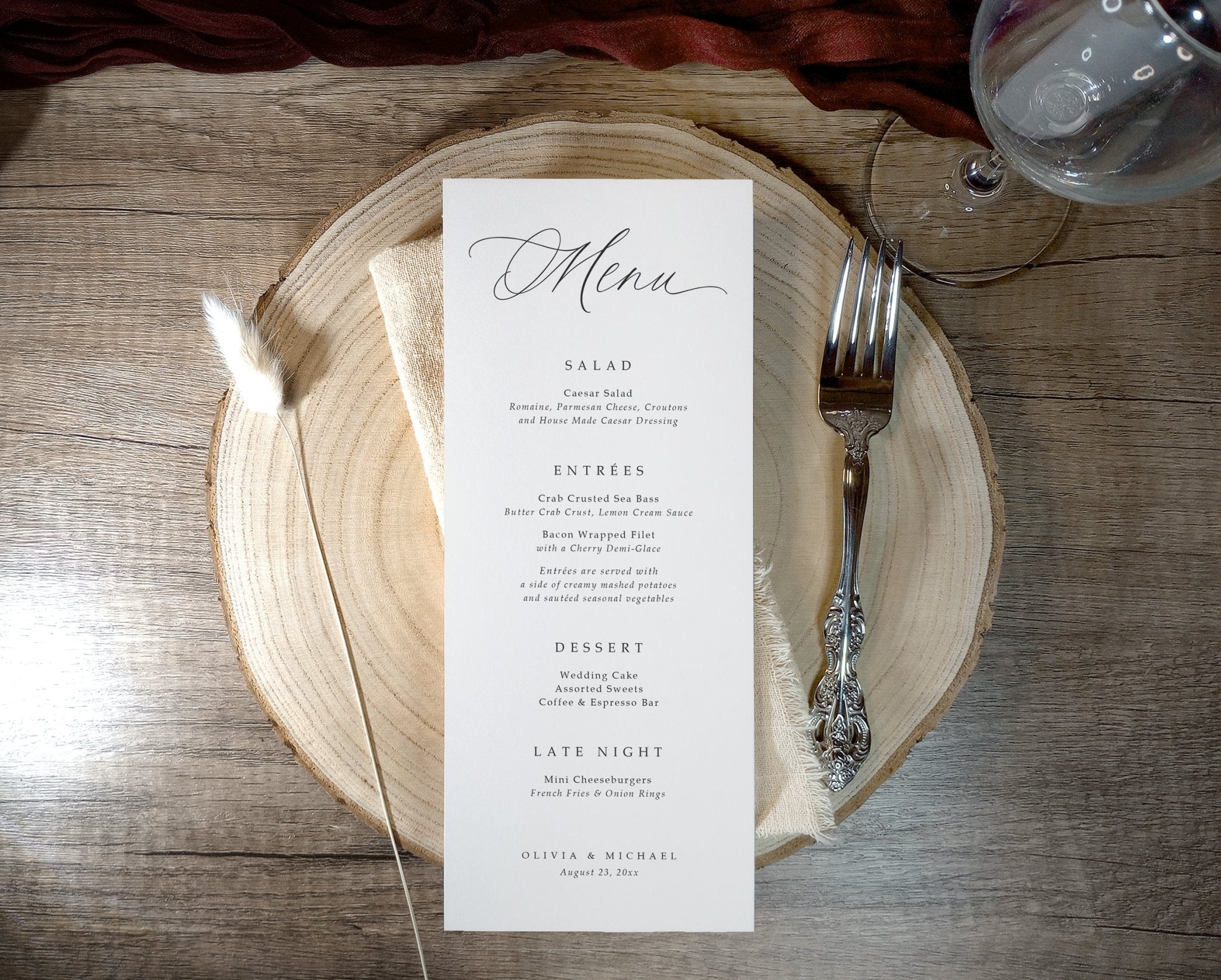 Wedding menu on a wooden plate with a fork on a rustic wooden table