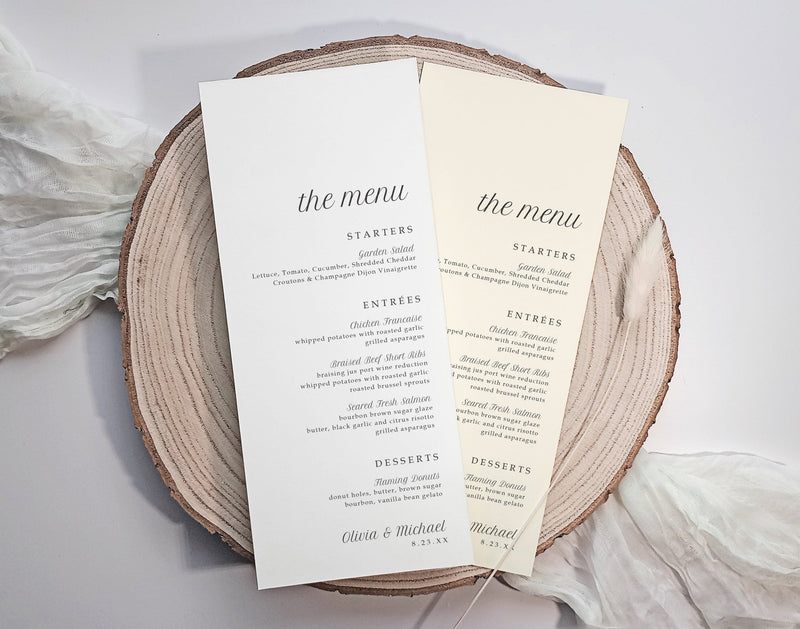 Two menu cards on a wooden plate with a white background