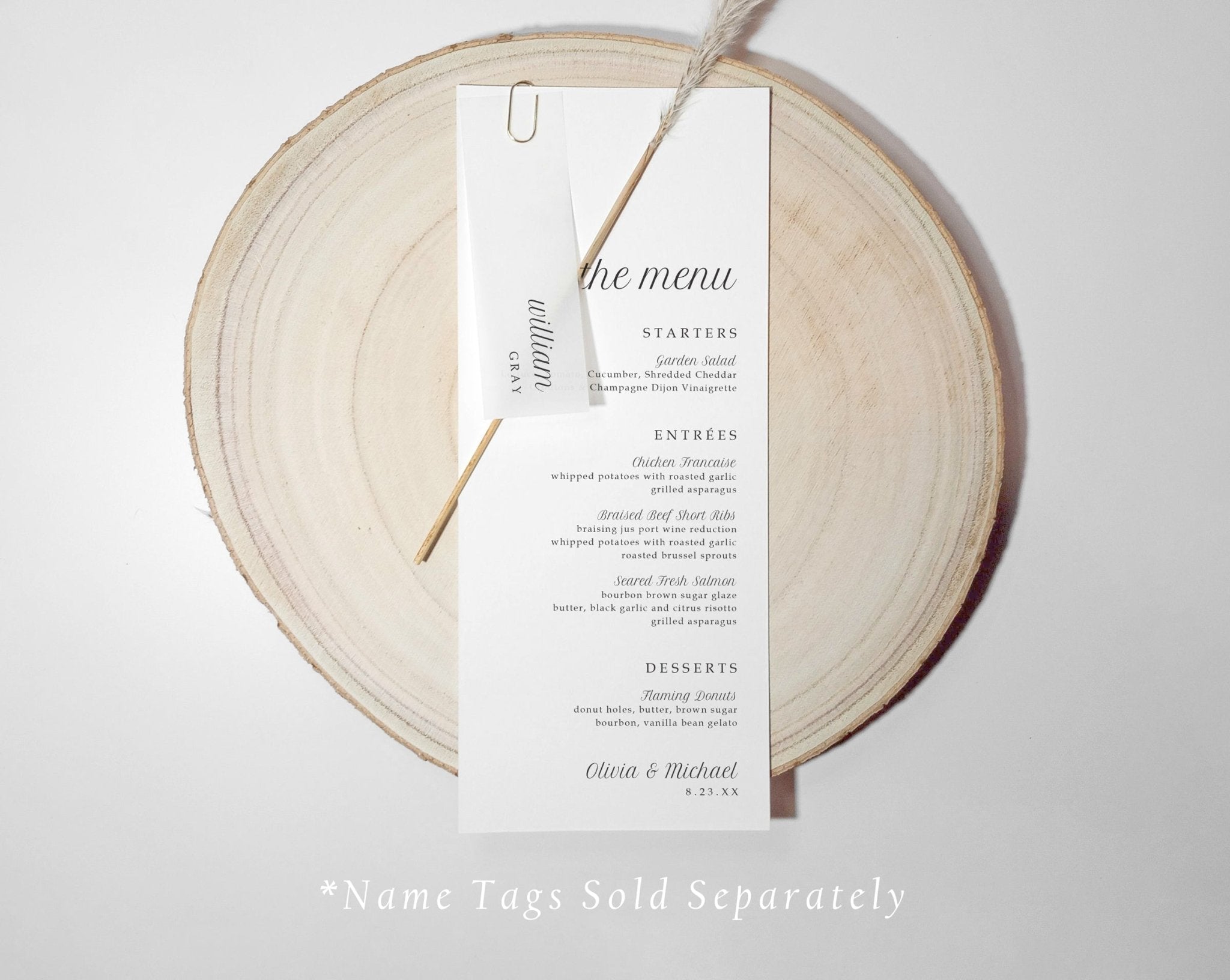 Wedding menu card with translucent name tag n a wooden round board with 'the menu' text.