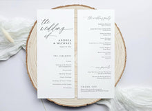Wedding program on a wooden round surface with a white background