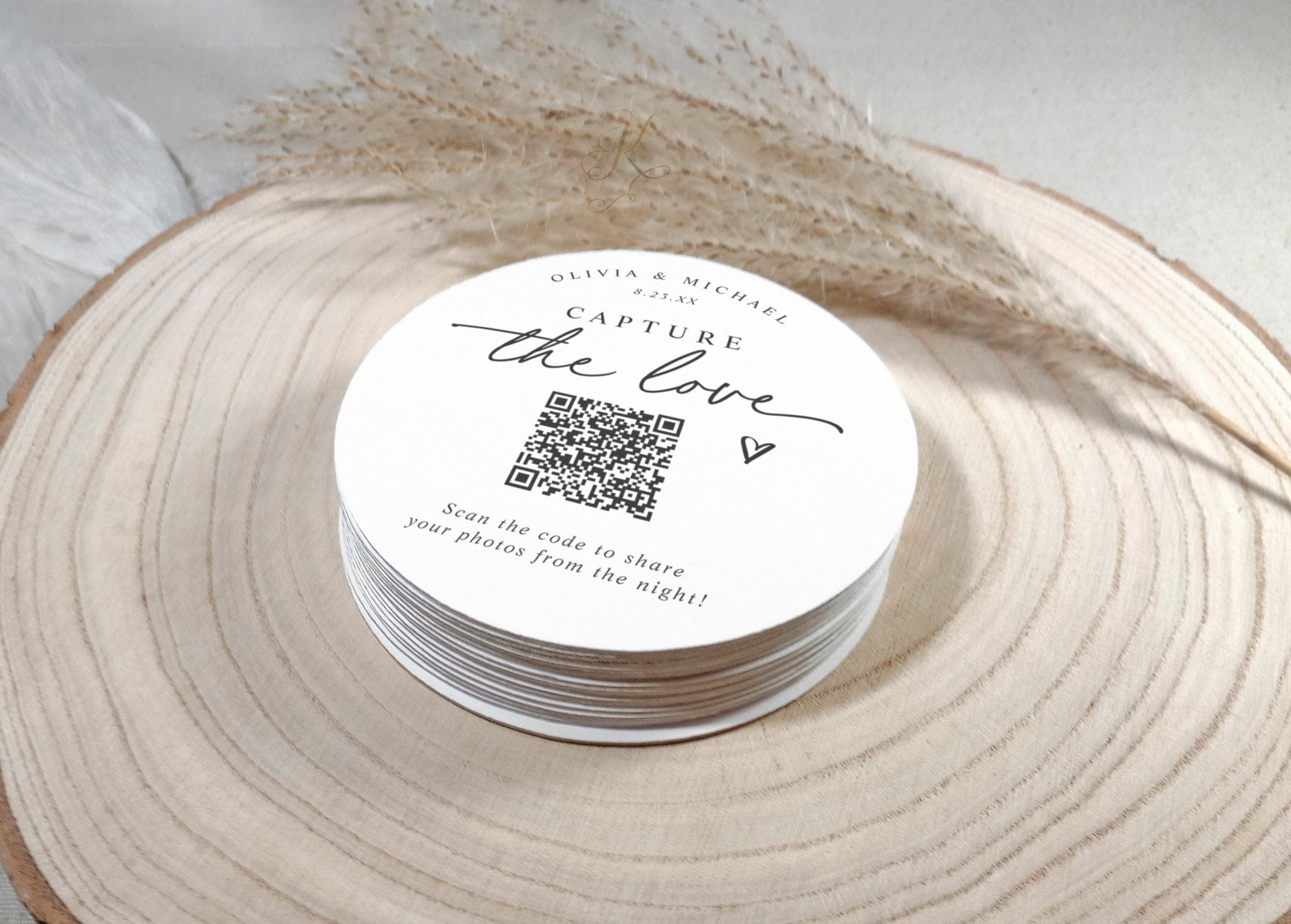 Stack of modern script QR code wedding coasters for guests to scan and upload photos