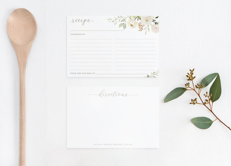 Recipe card with floral design, wooden spoon, and eucalyptus leaves on a white background