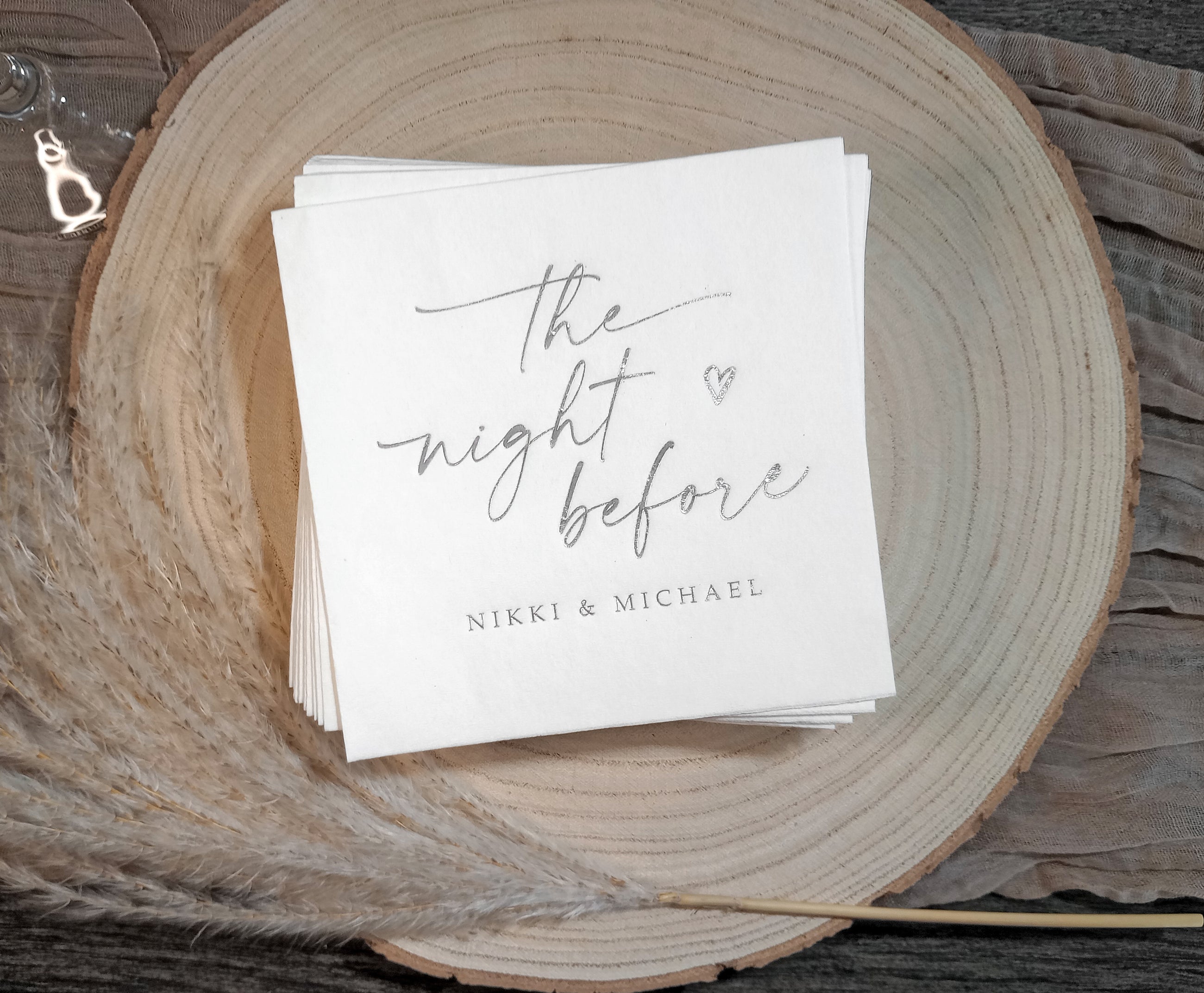 Elegant wedding napkin featuring ‘The Night Before’ in foil with custom names, perfect for rehearsal dinners.