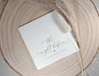 Custom rehearsal dinner napkin with elegant swirly calligraphy and couple’s names
