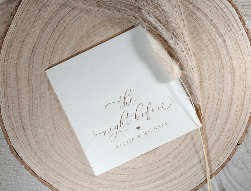 Custom rehearsal dinner napkin with elegant swirly calligraphy and couple’s names