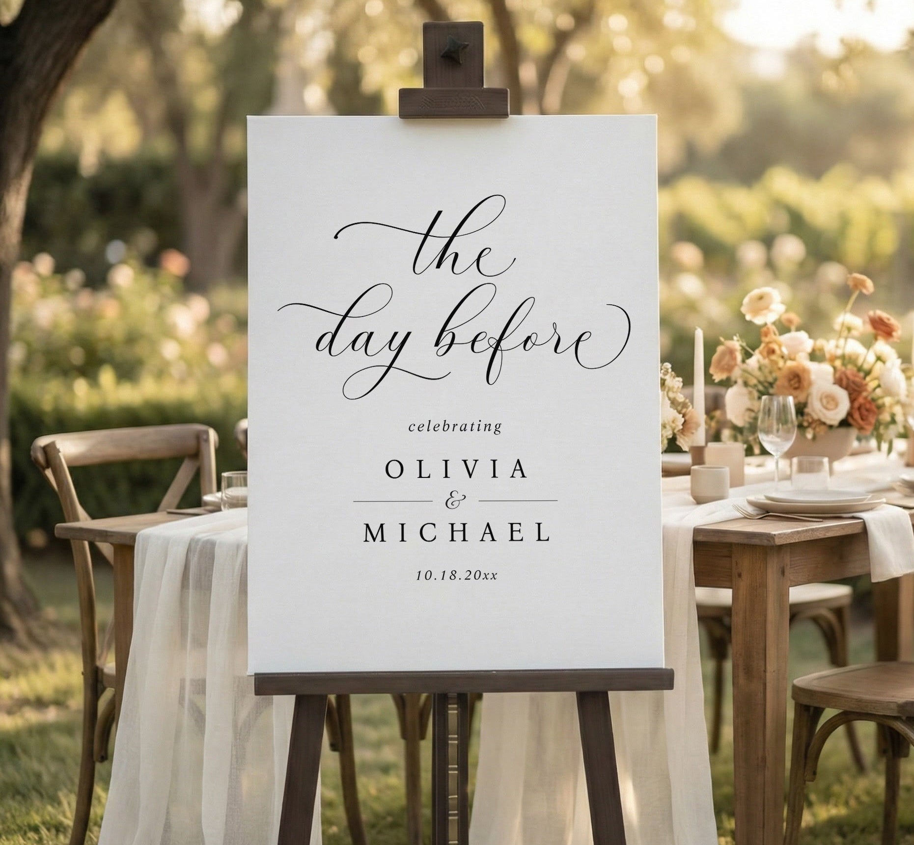 The Day Before rehearsal dinner welcome sign with black background and elegant white script
