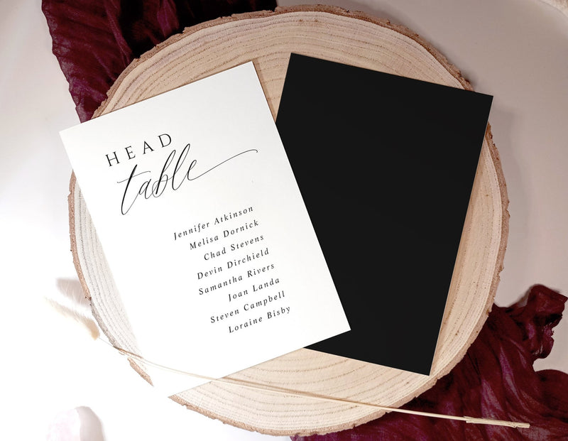 Elegant wedding seating chart header card with couple’s names and date in modern calligraphy