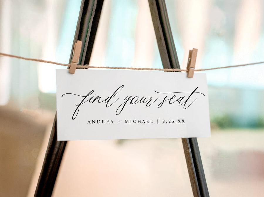 Black and white seating chart header card featuring romantic script and minimalist typography
