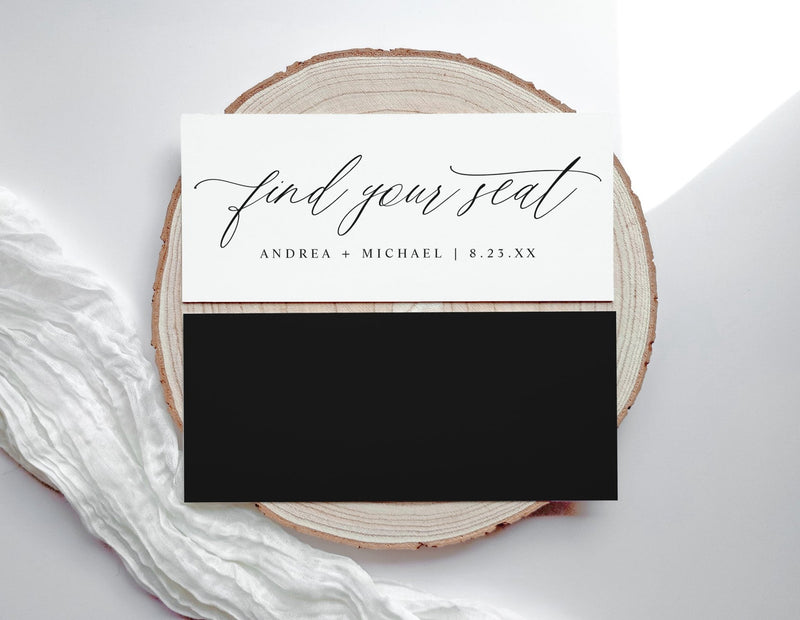 Wedding seating card with 'find your seat' text on a wooden slice and white fabric background