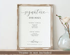 framed wedding bar sign reading “Signature Drinks” with two custom cocktails listed