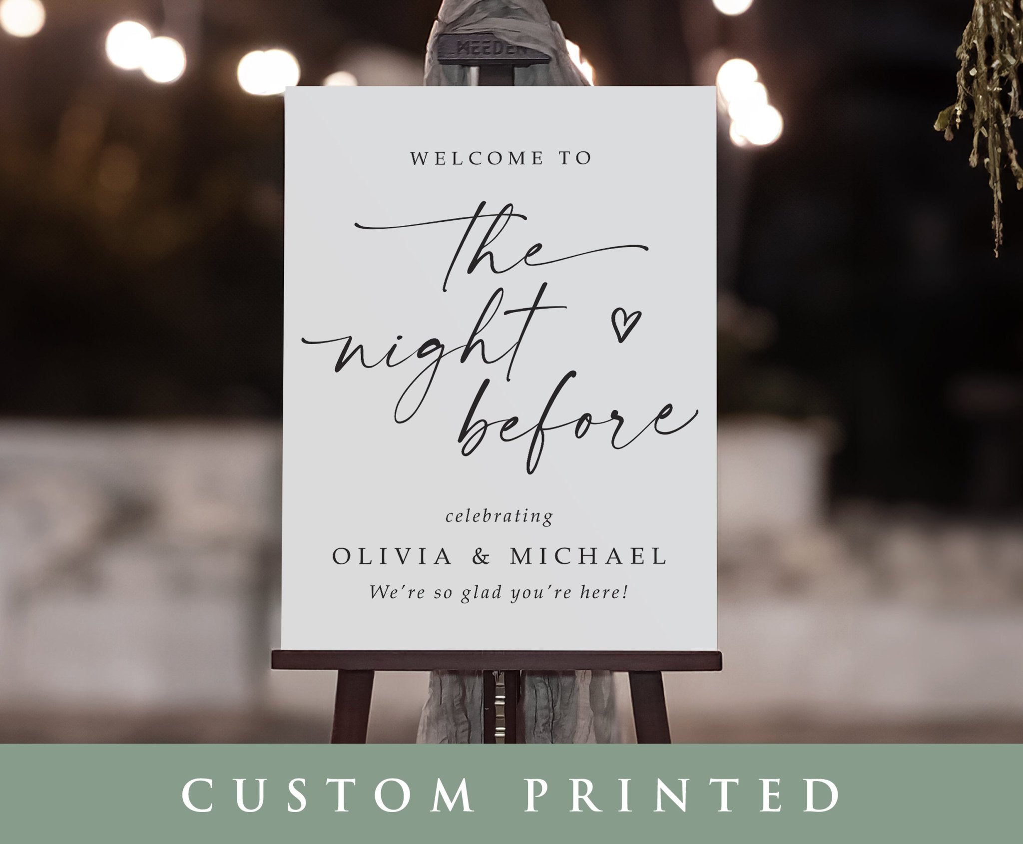 Custom printed sign on an easel with decorative lights in the background
