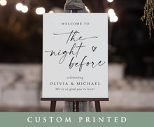Custom printed sign on an easel with decorative lights in the background