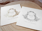 two vintage monogram wedding napkins with custom foil crest design in gold and silver