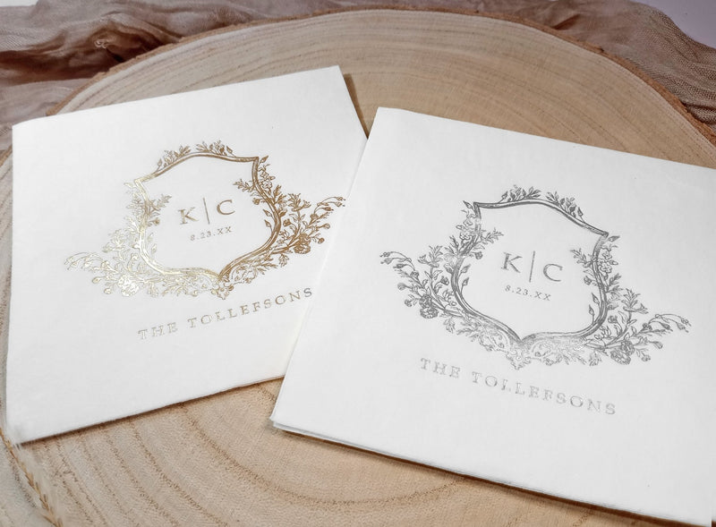 two vintage monogram wedding napkins with custom foil crest design in gold and silver