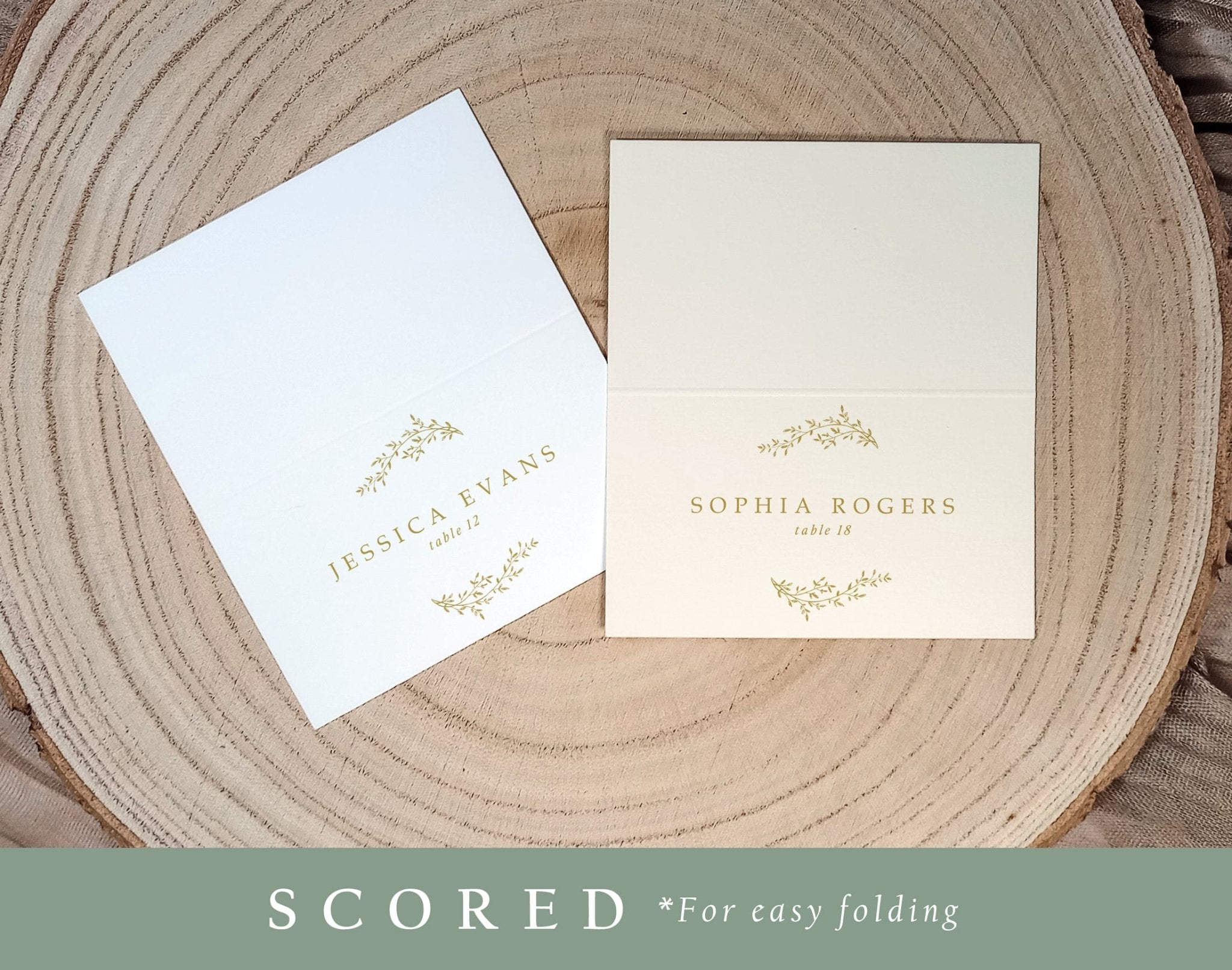 Custom printed gold place card for formal wedding, featuring classic laurel crest and guest names