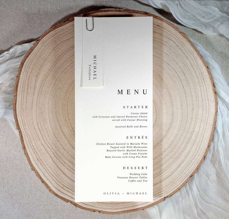 Menu card on a wooden plate with a neutral background
