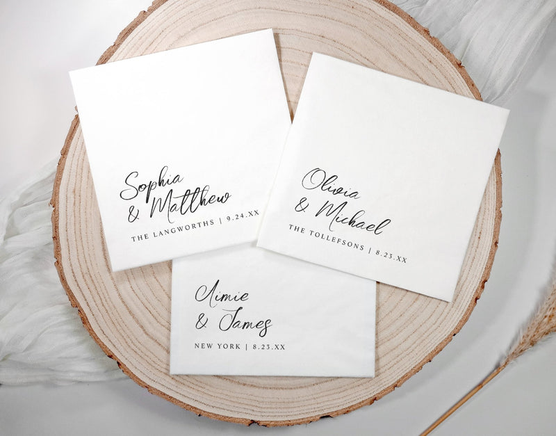 Elegant modern wedding napkins featuring simple script typography in black and white design.