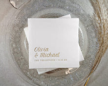 White foil stamped napkins with gold foil names on a decorative glass plate