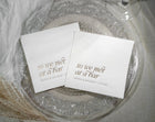 Custom foil wedding napkins fanned out to show metallic foil options and personalized text layout