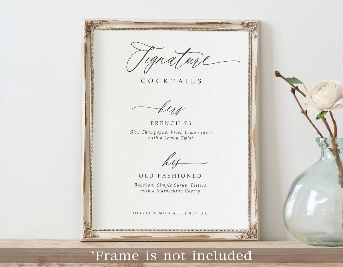 A framed custom printed signature cocktails menu sign with elegant script text reading 'Signature Cocktails' and course labels, displayed on a shelf beside a glass vase with a white flower. A note at the bottom says the frame is not included.