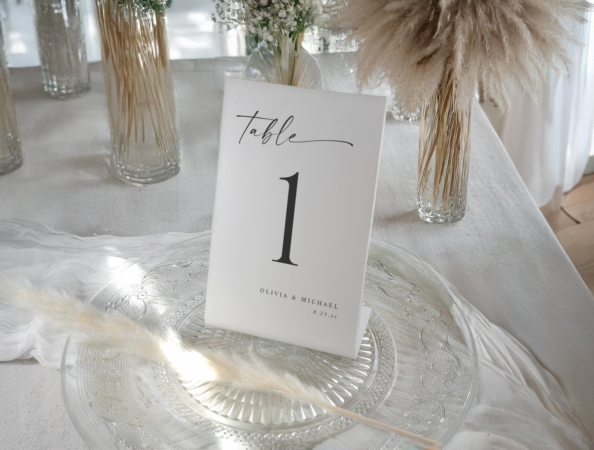 Modern black and white wedding table numbers with elegant minimalist typography.