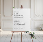 minimalist wedding welcome sign in serif font on foam board with floral base