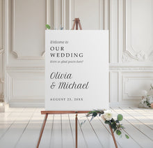 minimalist wedding welcome sign in serif font on foam board with floral base