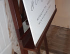 side angle close-up of personalized foam board wedding sign showing script calligraphy and thickness