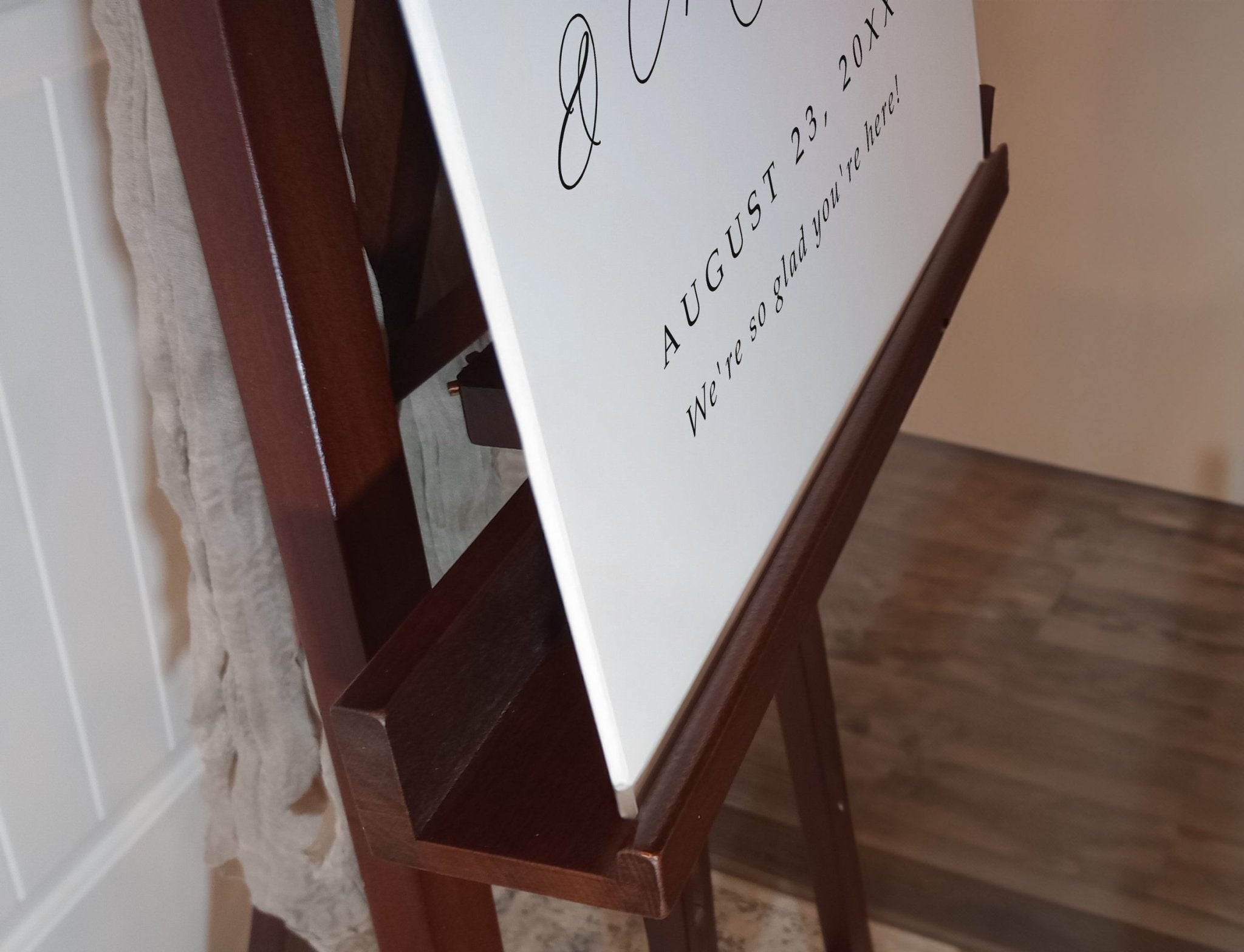 side angle close-up of personalized foam board wedding sign showing script calligraphy and thickness