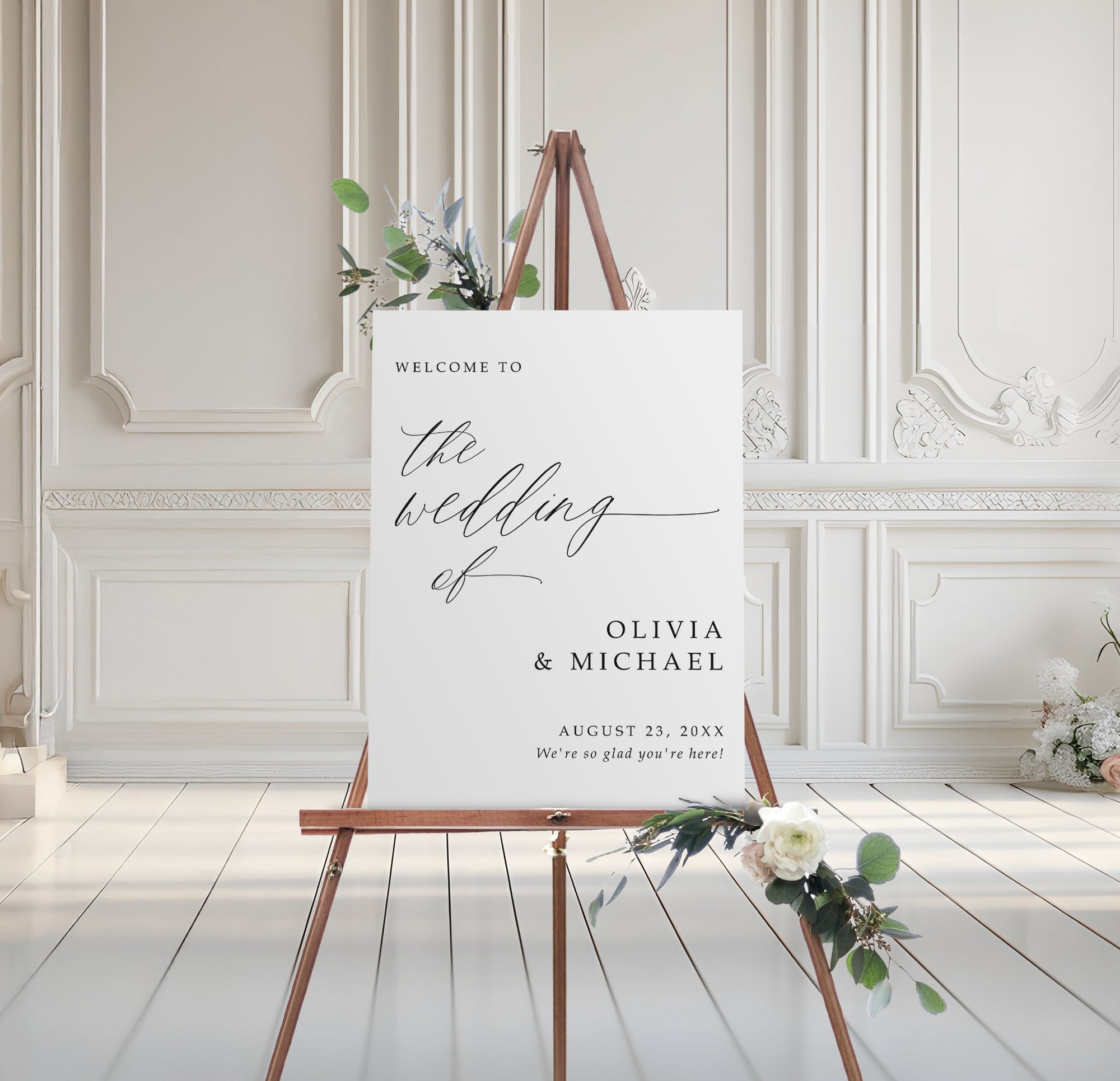 Wedding welcome sign on an easel with floral decorations in a elegant room.
