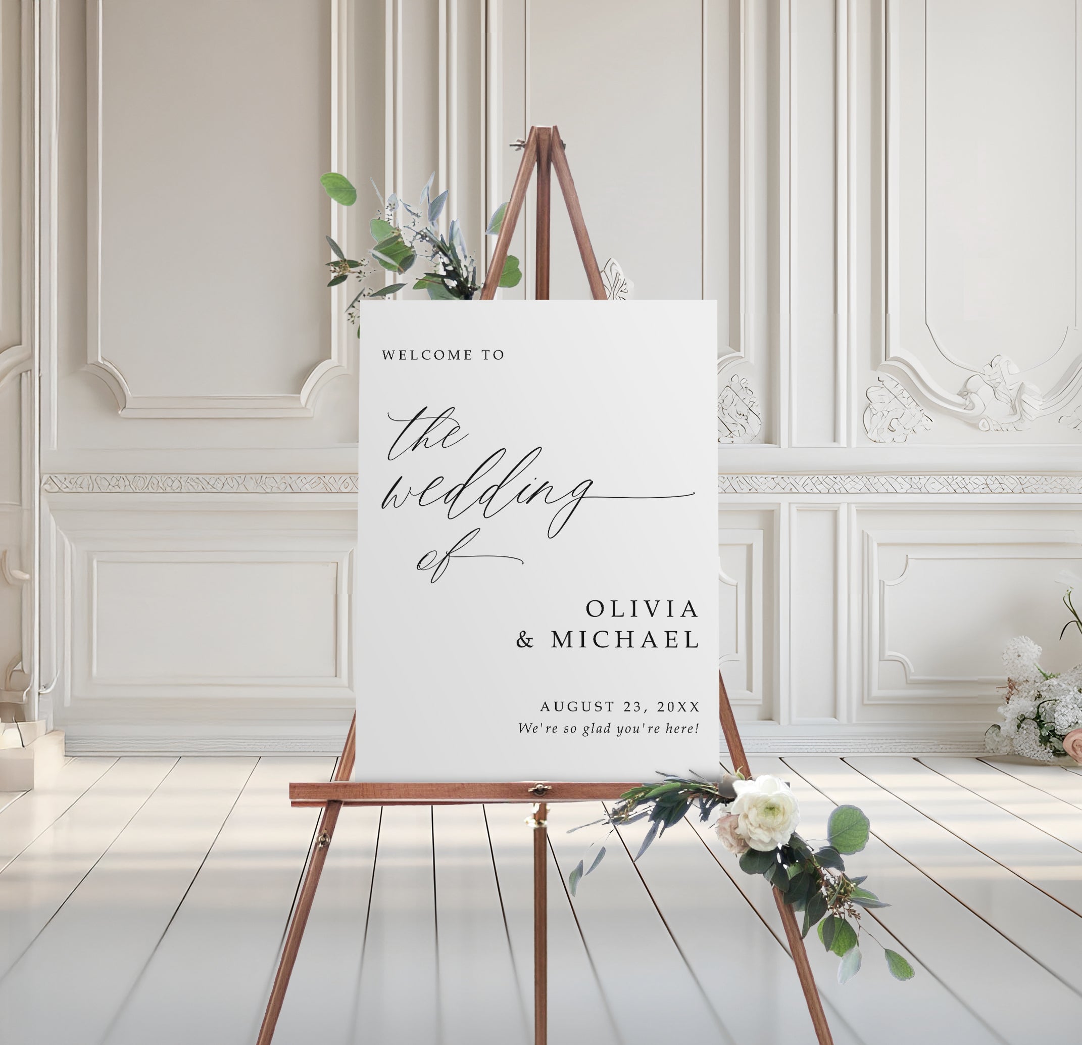 Wedding welcome sign on an easel with floral decorations in a elegant room.