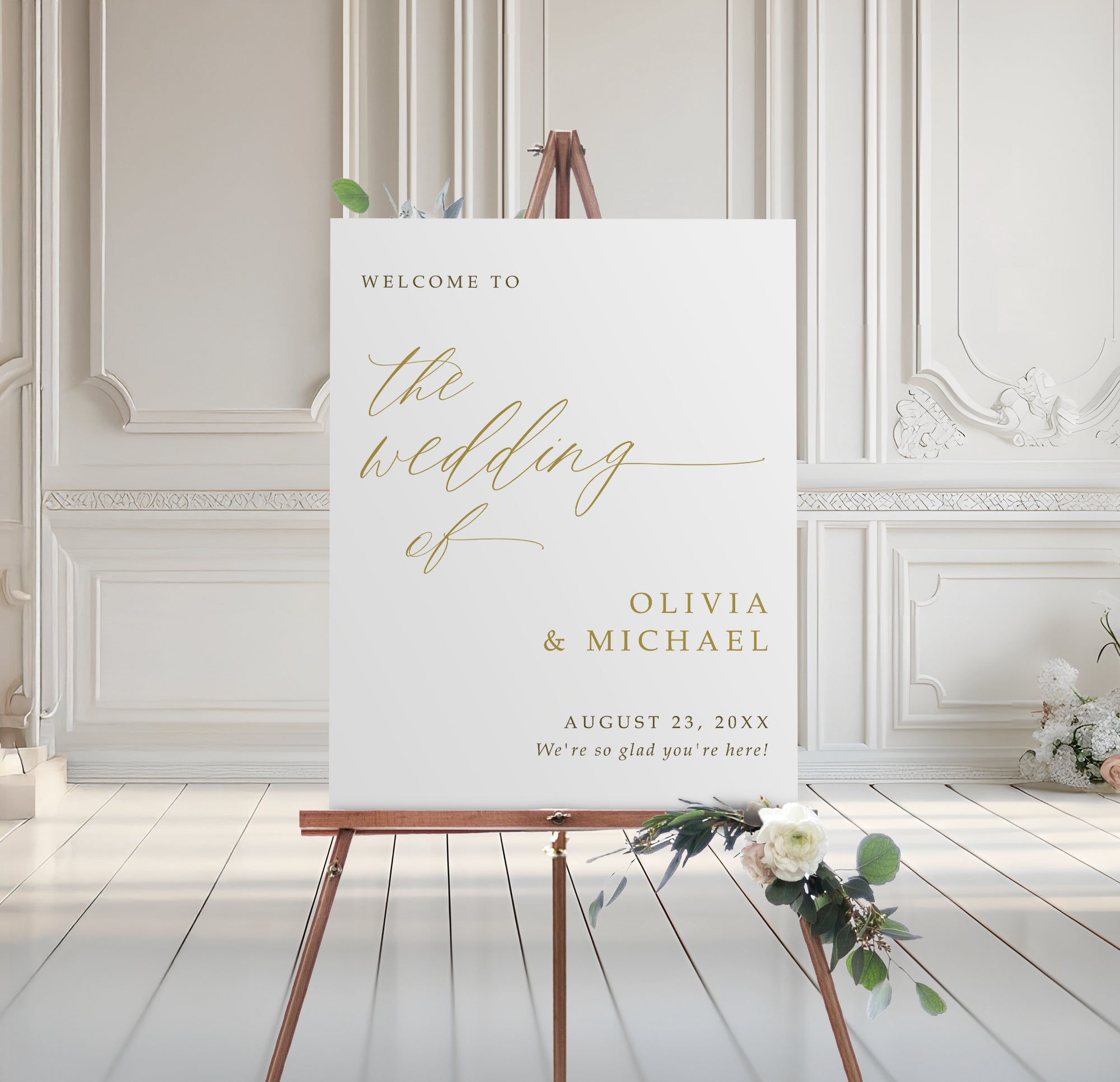 Wedding welcome sign on an easel with floral decorations in a elegant room.