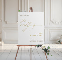 Wedding welcome sign on an easel with floral decorations in a elegant room.