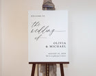 Wedding welcome sign on an easel with a neutral background