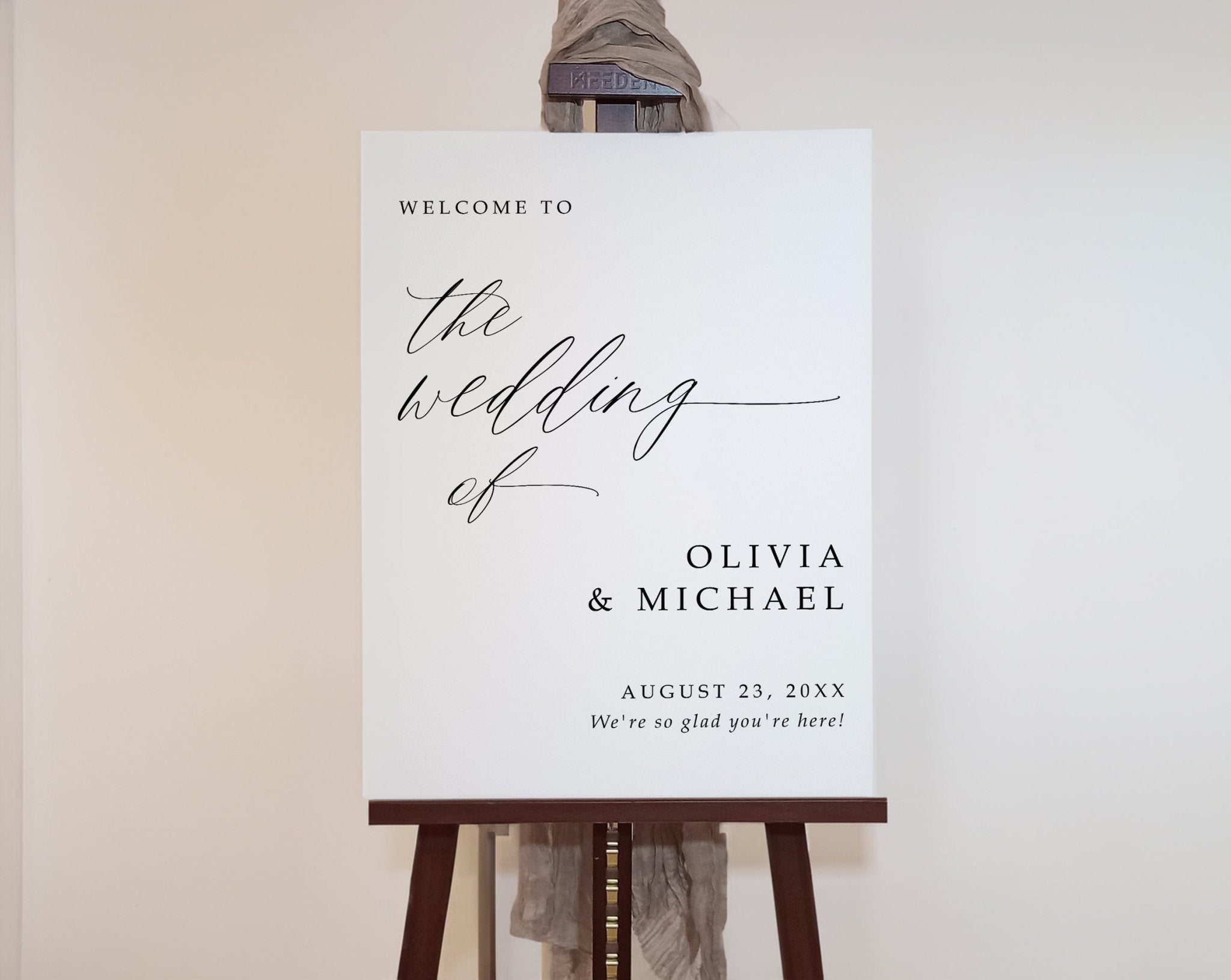 Wedding welcome sign on an easel with a neutral background