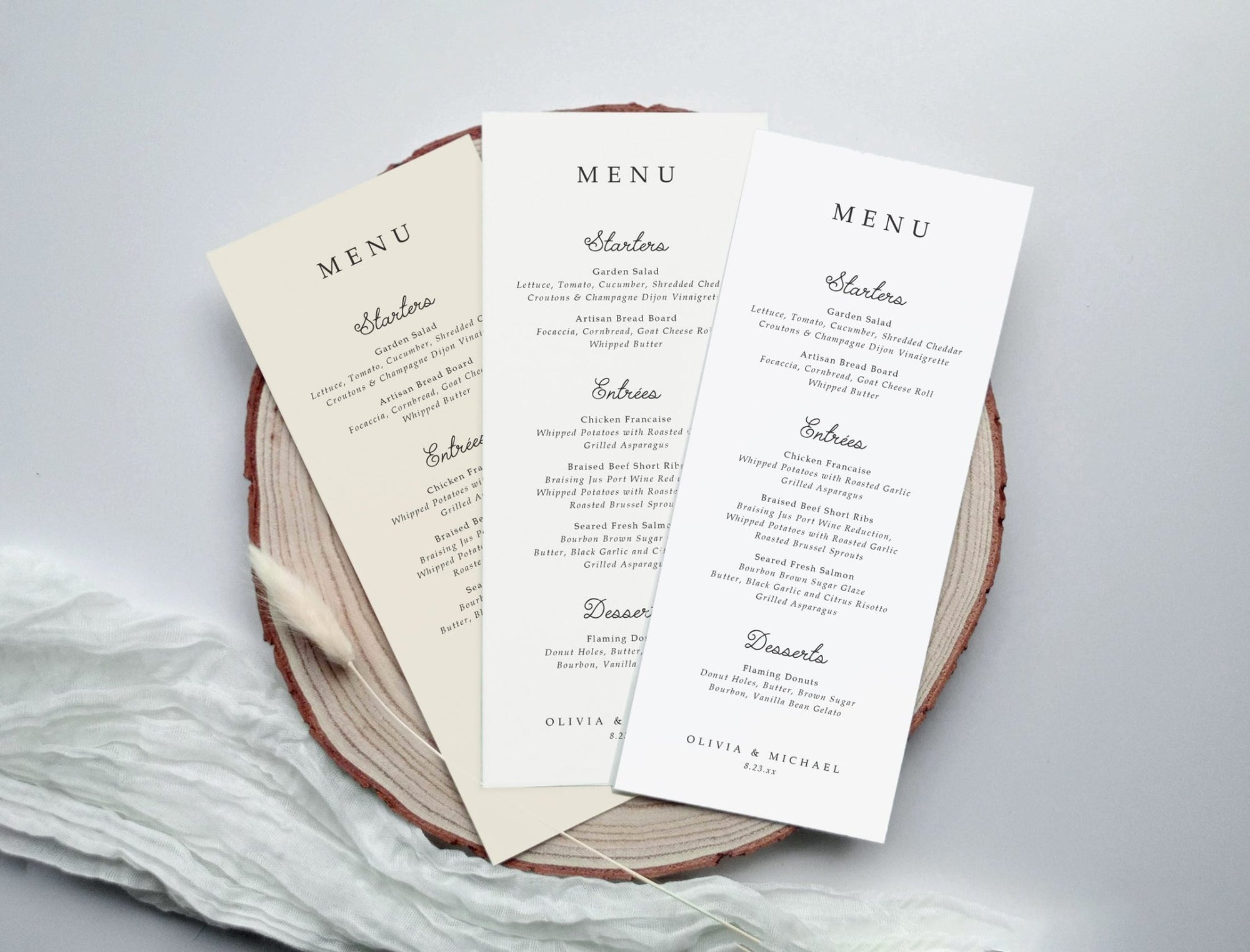 Set of minimalist menus with handwriting accents, displayed on a wood slice.