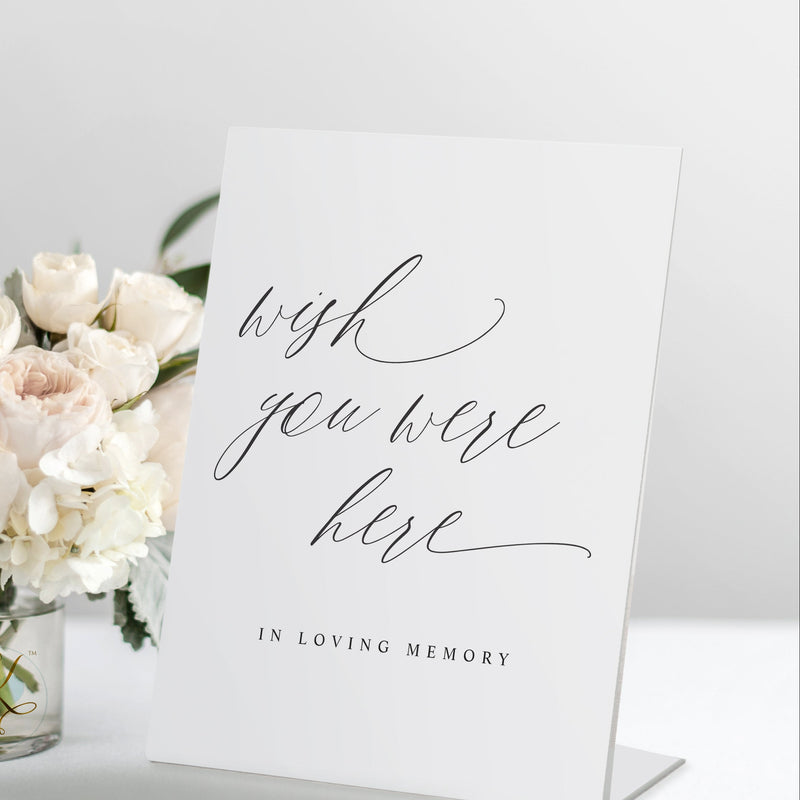 Standing “Wish You Were Here” wedding memorial sign in romantic calligraphy, styled on a remembrance table.
